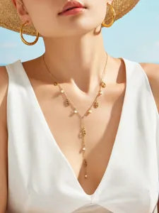 Detail view of the elegant Y-shaped gold necklace with pearls and chic link charms for women.