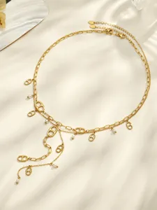 Gold-layered Y-shaped necklace featuring delicate pearl drops and unique geometric charms for women.