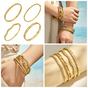Chic minimalist gold plated stainless steel cuff bracelet set featuring stunning cubic zirconia stones.