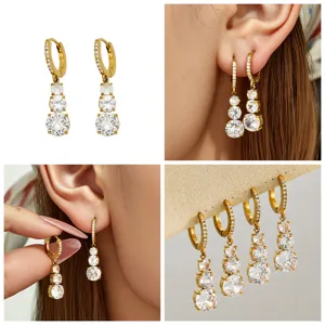 Exquisite PVD gold plated triple zirconia drop earrings, elegant luxury women jewelry detail.