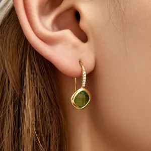 Stunning stainless steel green glass zirconia pendant earrings for women. Elegant jewelry.