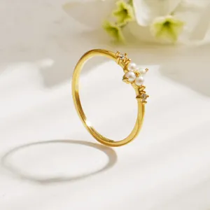 Minimalist gold stainless steel pearl flower ring with sparkling cubic zirconia for women.