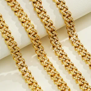 Gold cuban chain detail showing dazzling paved cubic zirconia links and stainless steel finish.