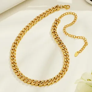 Gold-plated stainless steel cuban link rhinestone necklace with adjustable extension chain.