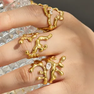 Gold-plated stainless steel irregular molten ring detail, modern geometric zirconia finger jewelry.
