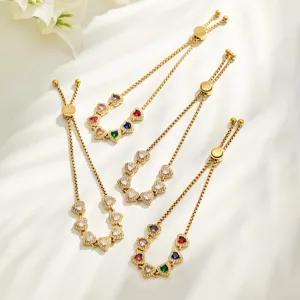 Close-up of gold-plated stainless steel multi-color heart cubic zirconia bracelets detail.