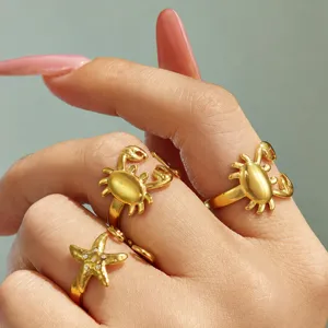 Gold ocean style open rings feature cute crab and starfish with sparkling zirconia crystals.