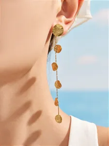 Stainless steel hammered coin long tassel earrings detail close up fashion jewelry