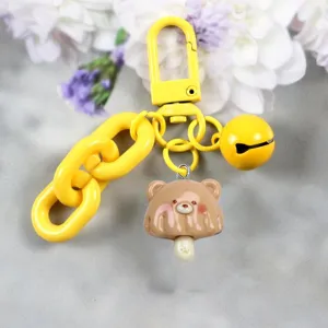 Resin cute bear ice cream keychain detail, yellow clasp chain and bell pendant charm.