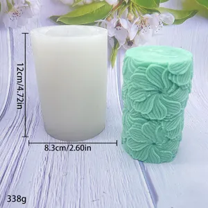 Cylindrical silicone candle mold with detailed floral embossed pattern, perfect for DIY aromatherapy.