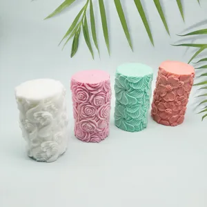 Set of four cylinder silicone candle molds featuring vintage floral, rose, and wave relief designs.