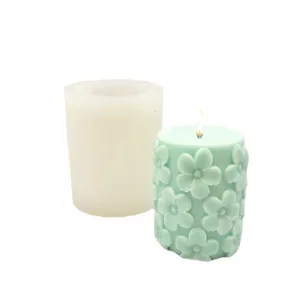 Cylindrical candle silicone mold set with 3D floral embossed scented candle for DIY crafts.