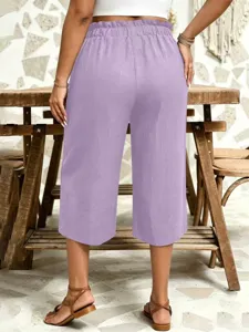 Detail view of casual loose solid color capri pants with high elastic ruffled waist design.