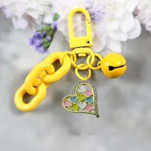 Colorful heart pendant keychain with yellow chain and bell, cute bag charm and accessory.
