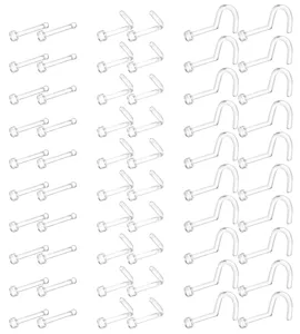 Clear plastic nose stud retainers and body piercing jewelry detail view, transparent piercing parts.