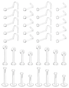 Clear acrylic body piercing retainer set details showing nose studs and labret studs clearly.