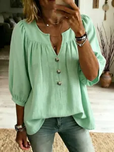 Top verde casual e ampio da donna con scollo a V e bottoni, perfetto per l'estate.