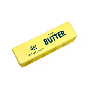 Nahaufnahme eines realistischen gelben Butter-Squishy-Spielzeugs zur Stressbewältigung