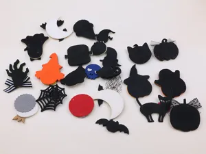 Details of Halloween DIY felt accessories, featuring cute ghosts, pumpkins, and spooky bats.