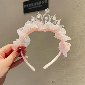 Girls pink mesh crown headband with pearls and rhinestones for birthday party performance hair.