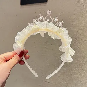 Kids princess crown headband with pearls, tulle ruffles, fairy hair accessory for party.