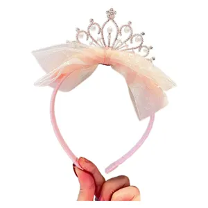 Kids pink crown headband with pearl rhinestone and big mesh bow for little girls party main view