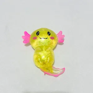 Niedliches gelbes Axolotl-Quetschspielzeug mit Glitzer zum Stressabbau und Spaß haben