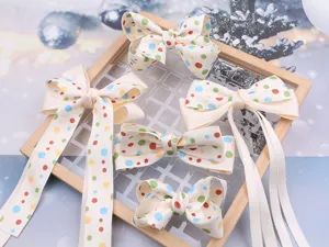 Cream white polka dot hair bow clips for girls, cute korean style hair accessories detail.