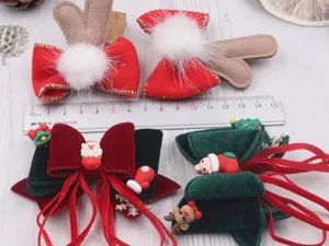Fermagli per capelli di Natale per bambini, corna di renna in velluto e fiocco dettaglio.