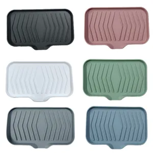 Portasapone in silicone con design di scarico, supporto antiscivolo per bagno e cucina.
