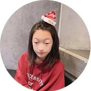 Cute mini Christmas hat hair clip for girls, festive holiday hair accessory for kids.