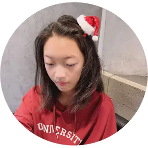 Cute mini Christmas hat hair clip for girls, sparkly red sequin holiday hair accessory.