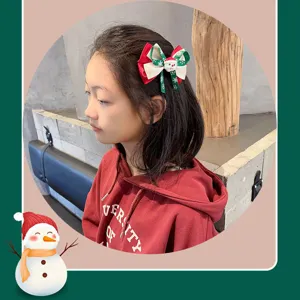 Pince à cheveux nœud écossais de Noël avec rubans et joli design pour les enfants.