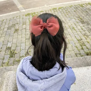 Children large organza bow hair clip, sweet red hair accessory worn on ponytail style.