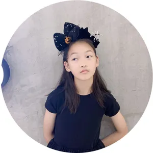Cute Halloween black hair bow headband with pumpkin and spider design for kids parties.