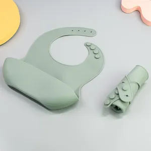 Waterproof silicone baby bib with crumb catcher pocket, soft roll-up toddler feeding bib for daily use.