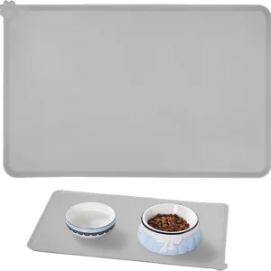Waterproof silicone pet feeding mat for cats and dogs with anti-spill raised edges grey.