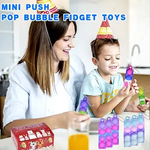 Detailansicht vom Mini Push Pop Bubble Fidget Toy Schlüsselanhänger aus buntem Silikon für Kinder.