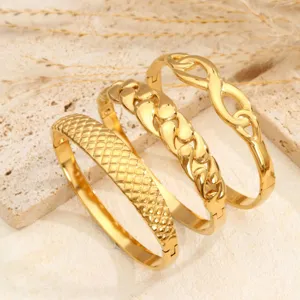 Set di bracciali rigidi in acciaio al titanio dorato, eleganti polsini aperti.