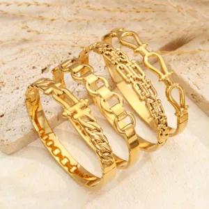 Set bracciale polsino con fibbia motivo serpente geometrico in acciaio dorato chic