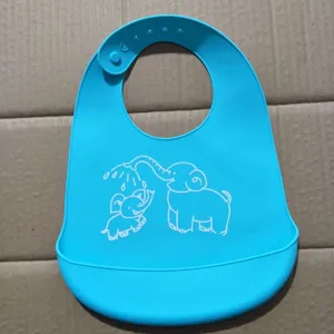 Silicone baby bib close-up, blue infant feeding bib detail with cute elephant print, soft.