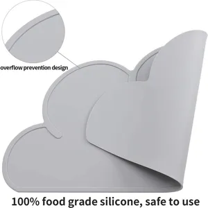 Detail view of the grey silicone cloud placemat showcasing raised anti-overflow edge design.