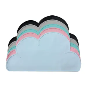 Closeup of stacked silicone cloud placemats in multiple pastel colors, detail view.