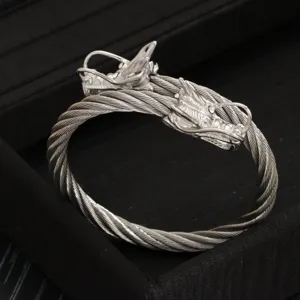 Bracciale rigido da uomo in acciaio inossidabile con testa di drago doppio intrecciato.