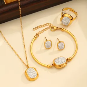 Gold stainless steel jewelry set featuring necklace bracelet earrings and ring with sparkling crystals.