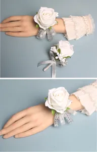Elegant white rose wrist corsage and boutonniere set for wedding bridal and bridesmaid.