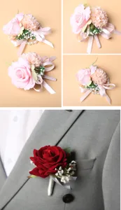 Detailed view of artificial wedding rose boutonnieres and wrist flowers with ribbons and pearls.