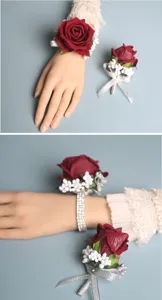 Red rose wrist corsage and boutonniere set for wedding bride bridesmaid party decor details.