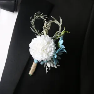 Elegant white and blue wedding boutonniere for groom, rustic style suit chest flower decoration.