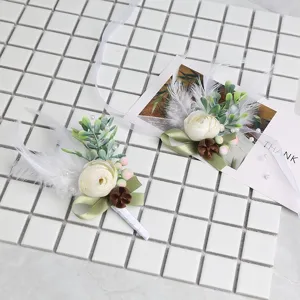 European style wedding boutonniere suit corsage with white rose and green leaves.